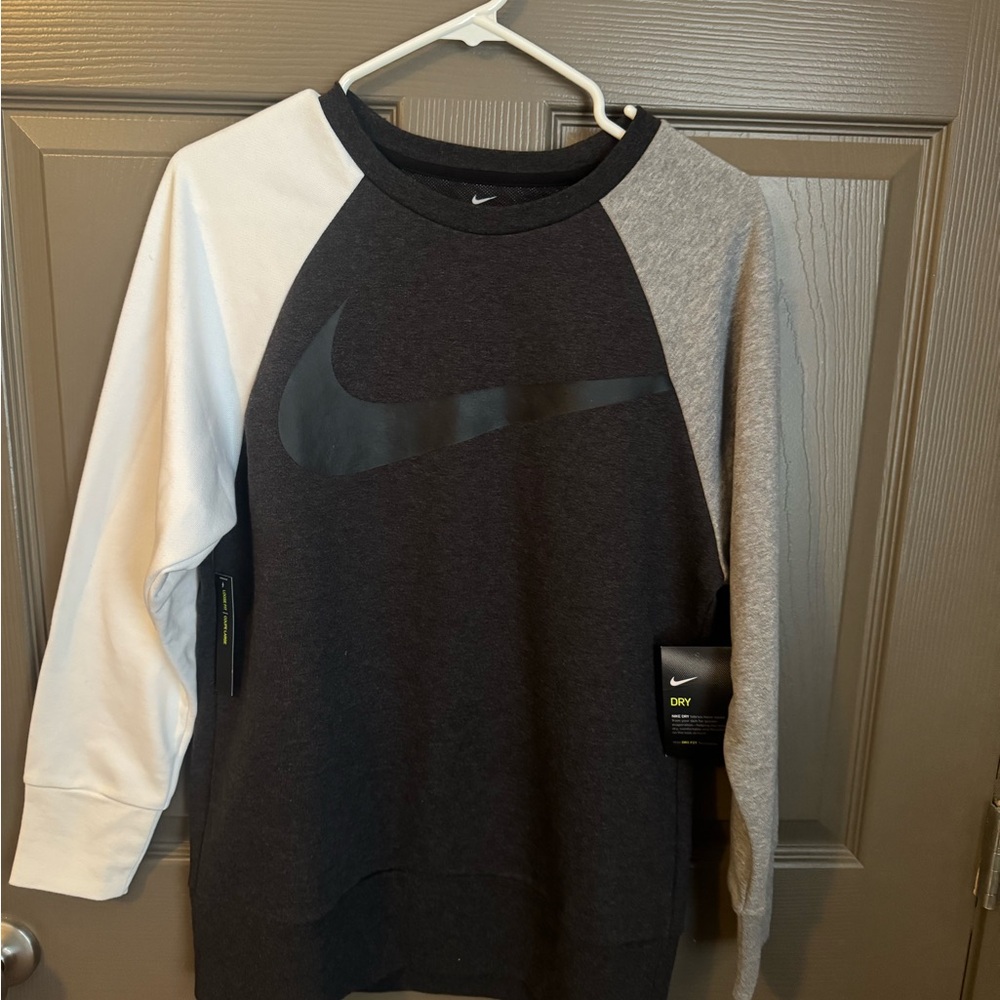 Women Nike Sweatshirt. Black, grey, and white.